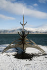 Viking boat in front of Mount Esja