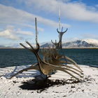 Viking boat in front of Mount Esja