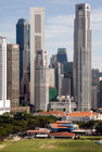 Singapore skyline with a cricket match taking place in the foreground