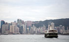 Star Ferry with Kowloon skyline in the background