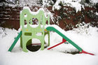 A children slide in the snow